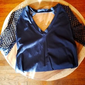 Venus, size medium, black netting in arms and back, v neck.